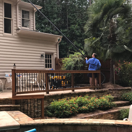 cleaning-gutters-by-pool-peachtree-city